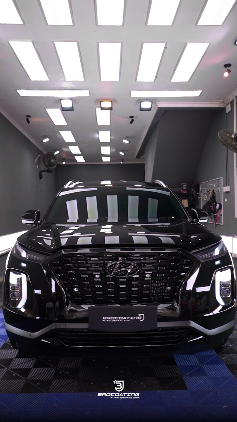 Freshly coated SUV under BROCOATING studio lights