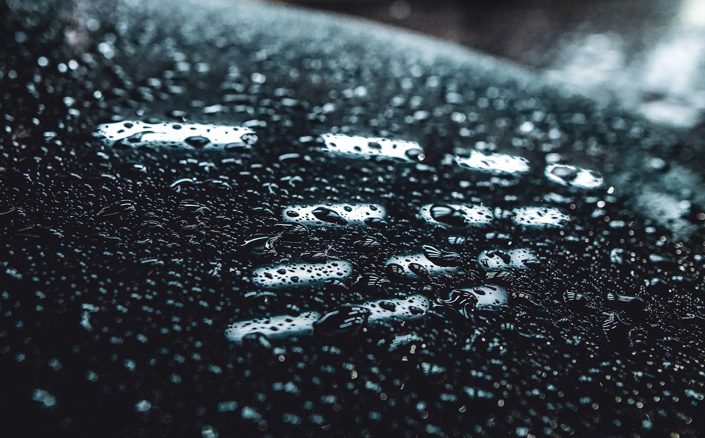 Water beading on freshly coated black paint