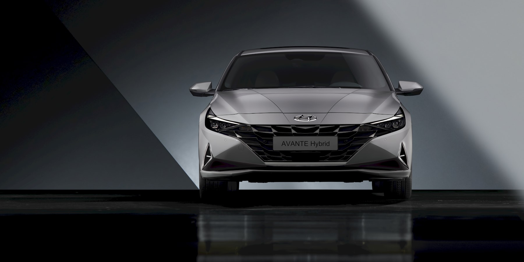 Hybrid sedan front view in studio lighting